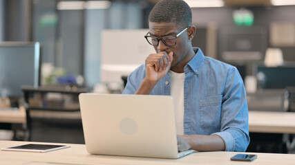 Young African Man Coughing at Working Office 