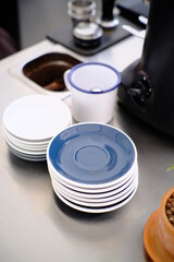 ceramic dish on barista desk in Coffee Shop