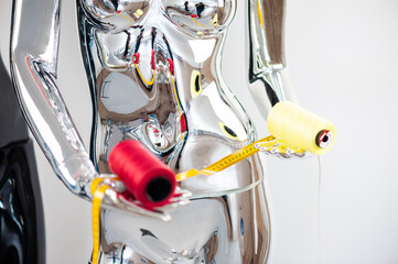 Fashion Design Studio.  Sewing fabrik concept. Mannequins with needles, threads and meter
