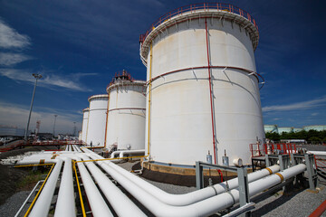 Row of large white tanks for petrol pipeline oil