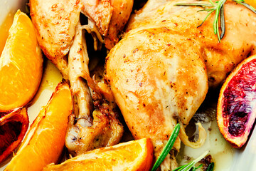 Roasted chicken legs with oranges