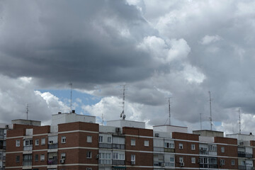 Heavy cloudscape over residential buildings in the district outskirts of Madrid, Spain