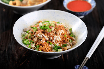Mie Ayam, Indonesian Popular Street Food with Noodle, Chicken, and Green Vegetables with Delicious Broth