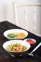 Mie Ayam, Indonesian Popular Street Food with Noodle, Chicken, and Green Vegetables with Delicious Broth