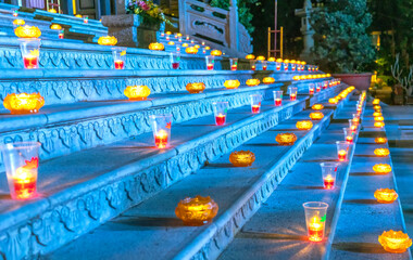 Candles shining in a glass lead the way to the temple's three jewels in celebration of Amitabha Buddha's astral ceremony