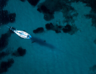 ship in turquoise waters from the air