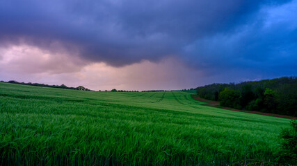 Spring storm clouds over Hampshire hills and lanes, South Downs National Park, UK