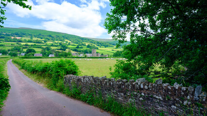 Fototapeta na wymiar Waterfall and ford on the country lane near Pennant below Gospel Pass and Lord Hereford's Knob, near Hay-on-Wye, Wales