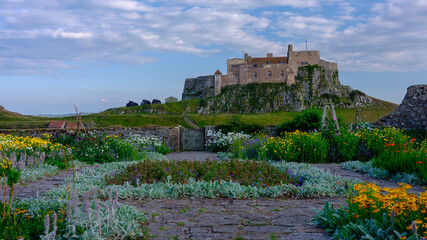 Summer evening and sunset views of Lindisfarne Castle on Holy Island, Northumberland, UK