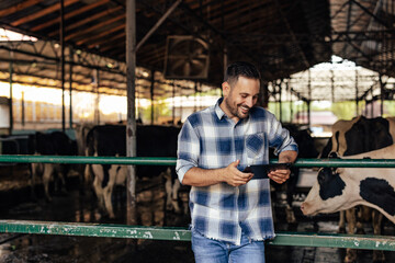 Adult man, checking all the pictures he took at the farm.