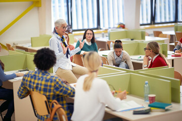 Female professor attracts students attention at a lecture