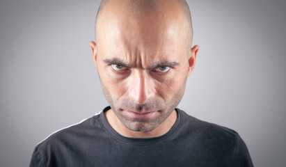 Obraz premium Caucasian angry and aggressive bald man.