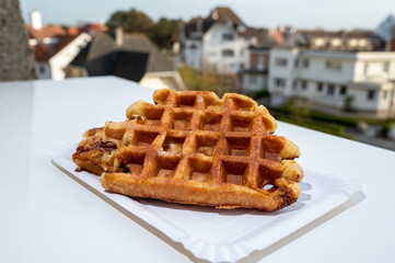 Belgian sugar waffles with black coffee served outdoor