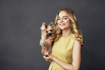 beautiful woman with a small dog makeup posing cropped view fashion