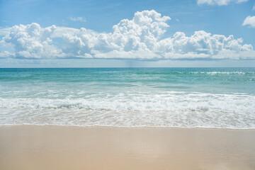 Beautiful Blue wave and white foamy nature on sunny summer day.Fantastic colorful sunset on surfing  beach.Amazing dramatic blue sky and clouds daylight.