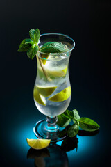 Mojito cocktail with ice, lime, and mint.