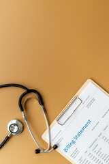 Stethoscope with medical billing statement. Top view