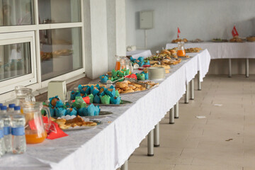 Catering or self-service desk for a conference or business meeting. Snacks and drinks for a light snack in the office.