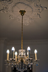 vintage chandelier with shiny beautiful crystals hanging from the ceiling