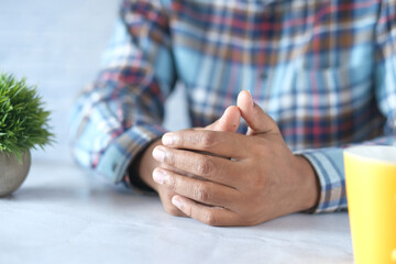 a nervous young man hand 