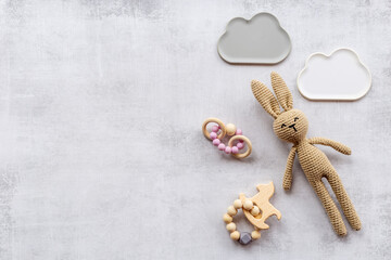 Baby toy rabbit with wooden accessories, overhead view