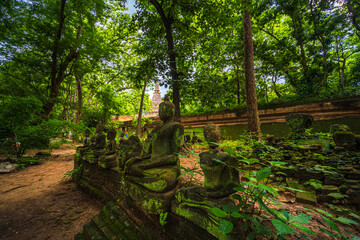 Ancient buddha figures Wat Umong Suan Puthatham is a Buddhist temple in the historic centre and is a Buddhist temple is a major tourist attraction with green forest nature in Chiang Mai,Thailand.