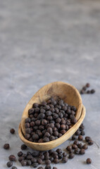 Wooden bowl of black chickpea closeup