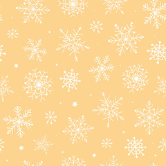 Winter seamless pattern with hand drawn snowflakes on light brown  beige background. Good for wrapping paper, scrapbooking, textile prints, holiday decorations, wallpaper, digital paper, etc.