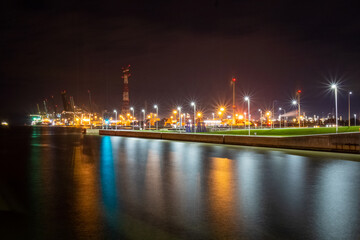 Fototapeta na wymiar heavy industry near waterway causing emmissions. High quality photo