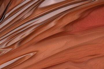 Light brown abstract with light lines. Beautiful, glossy surface. A stream of chocolate. Shiny texture.