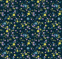 Beautiful floral pattern in small abstract flowers. Small colorful flowers. Blue background. Ditsy print. Floral seamless background. The elegant the template for fashion prints. Stock pattern.
