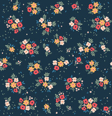 Fototapeta na wymiar Cute floral pattern in the small flowers. Seamless vector texture. Elegant template for fashion prints. Printing with small red, yellow and white flowers. Dark blue background.