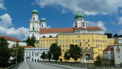 Passau, Germany - May 9. 2014: Street view on jesuit St. Miachaels church against blue summer sky