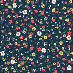 Cute floral pattern. Seamless vector pattern. Elegant template for fashion prints. Small colorful flowers. Dark blue background. Summer and spring motifs. Stock vector.