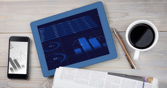Statistical data processing on screens of digital table and smartphones on wooden surface