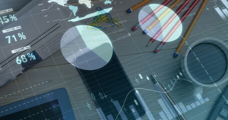 Image of financial data processing over desk with tablet and smartphone