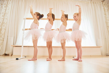 Conception of art. Little ballerinas preparing for performance