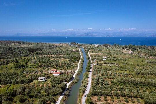 Aerial drone photo photo of water canal in Lefkimmi, small town near Ionian Sea coast on Corfu - Kerkyra Island, Greece