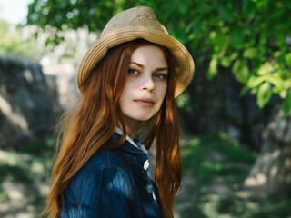 red-haired woman in hat outdoors sun walk leisure