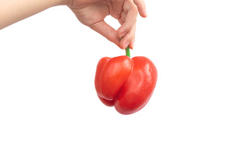 Woman holding red sweet bell pepper in hand isolated on a white background