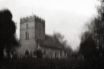 An atmospheric church in the English countryside. On a moody winters day. With a grunge, textured edit.
