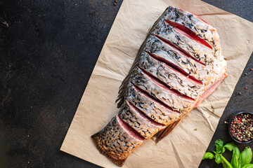 fresh raw fish carp white fish headless carcass meal snack on the table copy space food background...