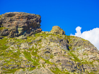 Veslehødn Veslehorn mountain peak rocks cliffs Hydnefossen waterfall Hemsedal Norway.