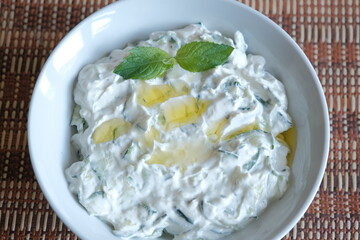 Tzatziki - Greek yogurt sauce. Traditional Tzatziki yoghurt sauce with cucumbers, olive oil and spices