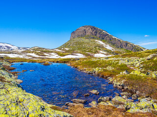 Fototapeta na wymiar Amazing mountain peak at Veslehødn Veslehorn Hydnefossen waterfall Hemsedal Norway.