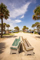 Fototapeta na wymiar Empty benches at St Augustine Beach Florida USA