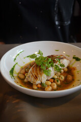 Pan fried Seabass fillet with beans and pea.