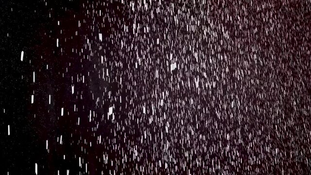 cristmas snowfall in the darkness, slow motion 50% of speed 4K