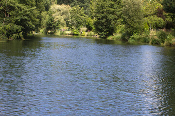 ripples and reflections on water for peaceful river or lake