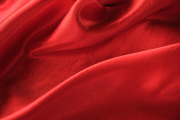 abstract texture of draped red velvet background. eautiful textile backdrop. Close-up. Top view